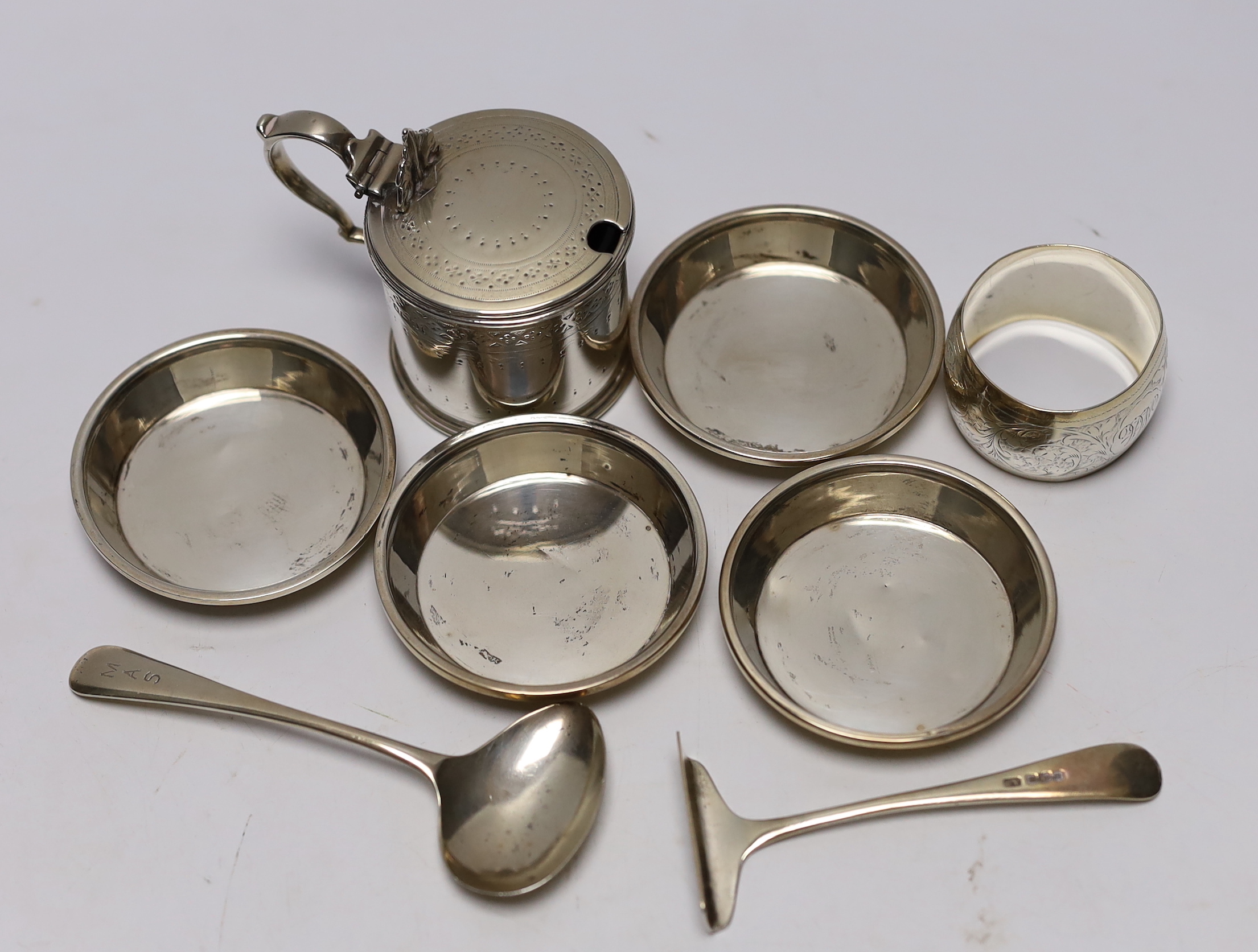 A Victorian silver mustard pot, Martin, Hall & Co, Sheffield, 1885, a set of four small silver dishes by Walker & Hall, a silver spoon & pusher and a silver napkin ring.